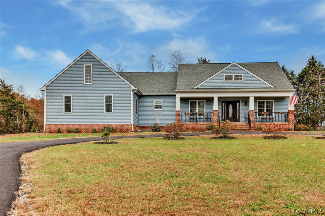 4515 Three Chopt Road Gum Spring, VA 23065 - Photo 2 of 36 a front view of a house with swimming pool and porch with furniture