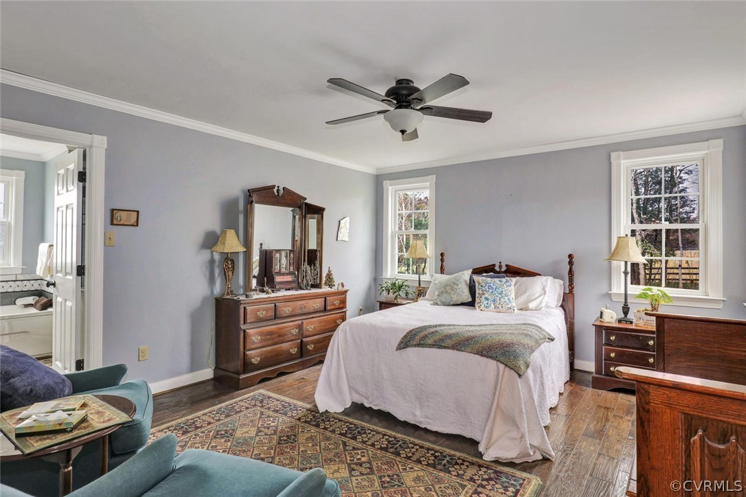 4515 Three Chopt Road Gum Spring, VA 23065 - Photo 23 of 36 a bedroom with a bed and a chandelier