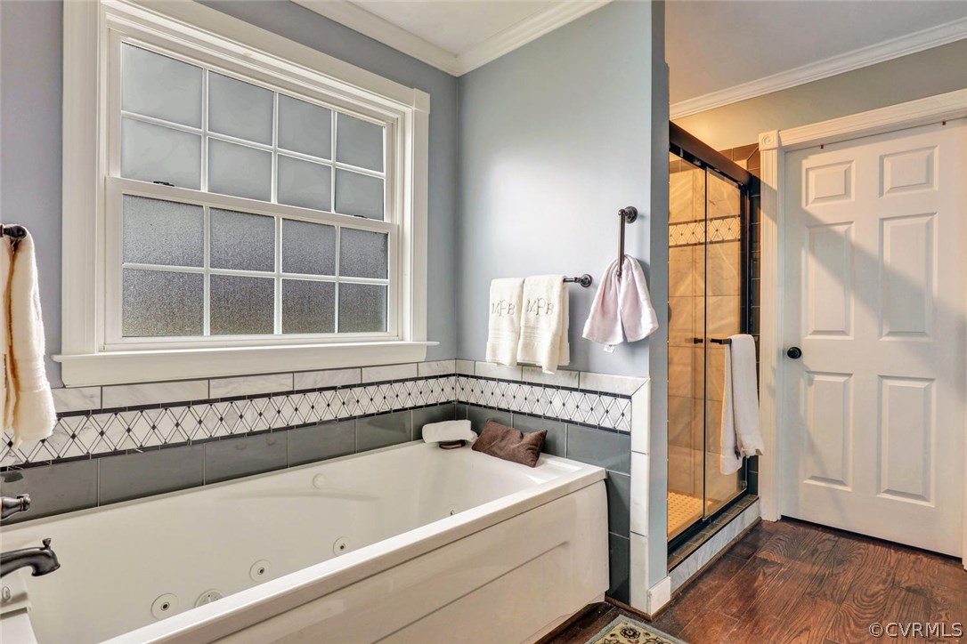 4515 Three Chopt Road Gum Spring, VA 23065 - Photo 25 of 36 a bathroom with a bathtub and a window