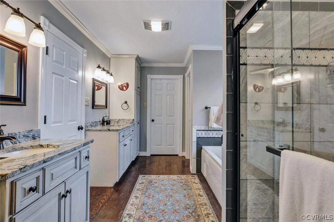 4515 Three Chopt Road Gum Spring, VA 23065 - Photo 26 of 36 a bathroom with a granite countertop double vanity sink a mirror and a shower