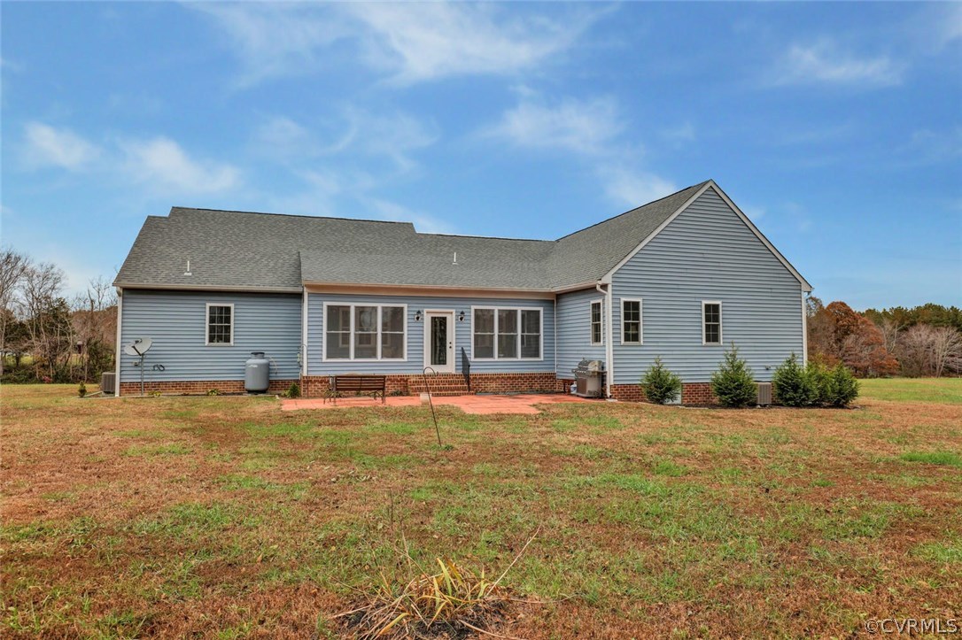 4515 Three Chopt Road Gum Spring, VA 23065 - Photo 36 of 36 a front view of a house with a yard