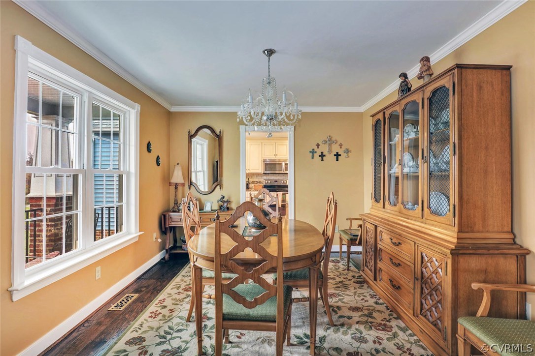 4515 Three Chopt Road Gum Spring, VA 23065 - Photo 5 of 36 a view of a dining room with furniture a chandelier and wooden floor