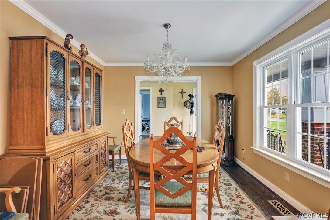 4515 Three Chopt Road Gum Spring, VA 23065 - Photo 6 of 36 a dining room with furniture a chandelier and wooden floor