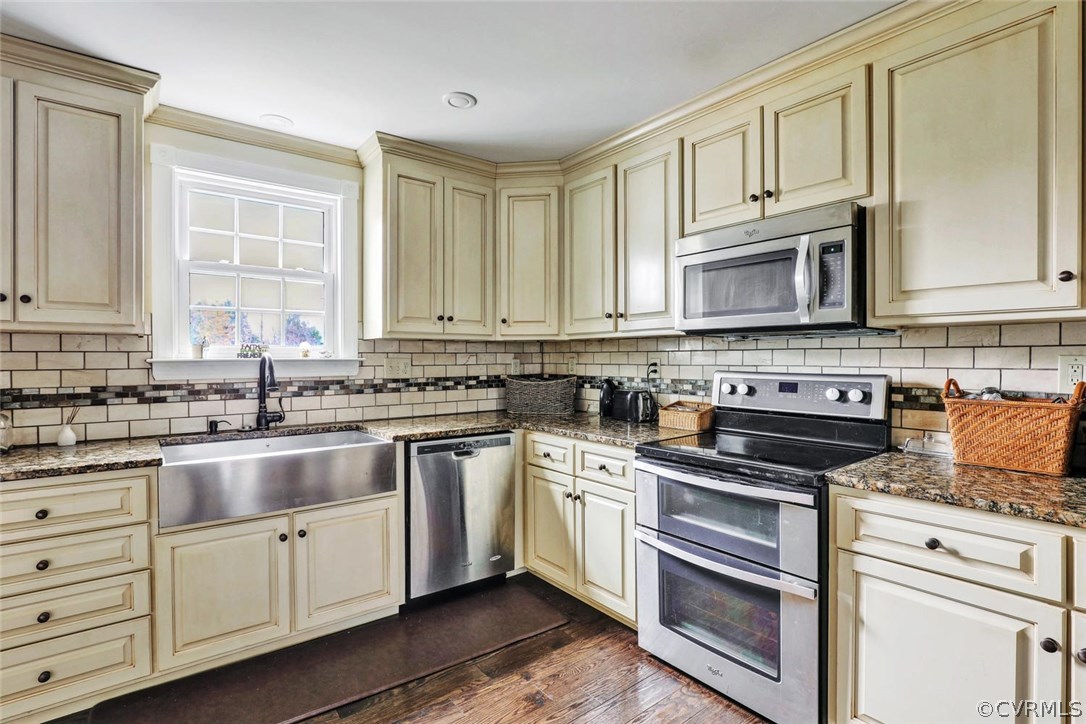 4515 Three Chopt Road Gum Spring, VA 23065 - Photo 10 of 36 a kitchen with cabinets appliances a sink and a window