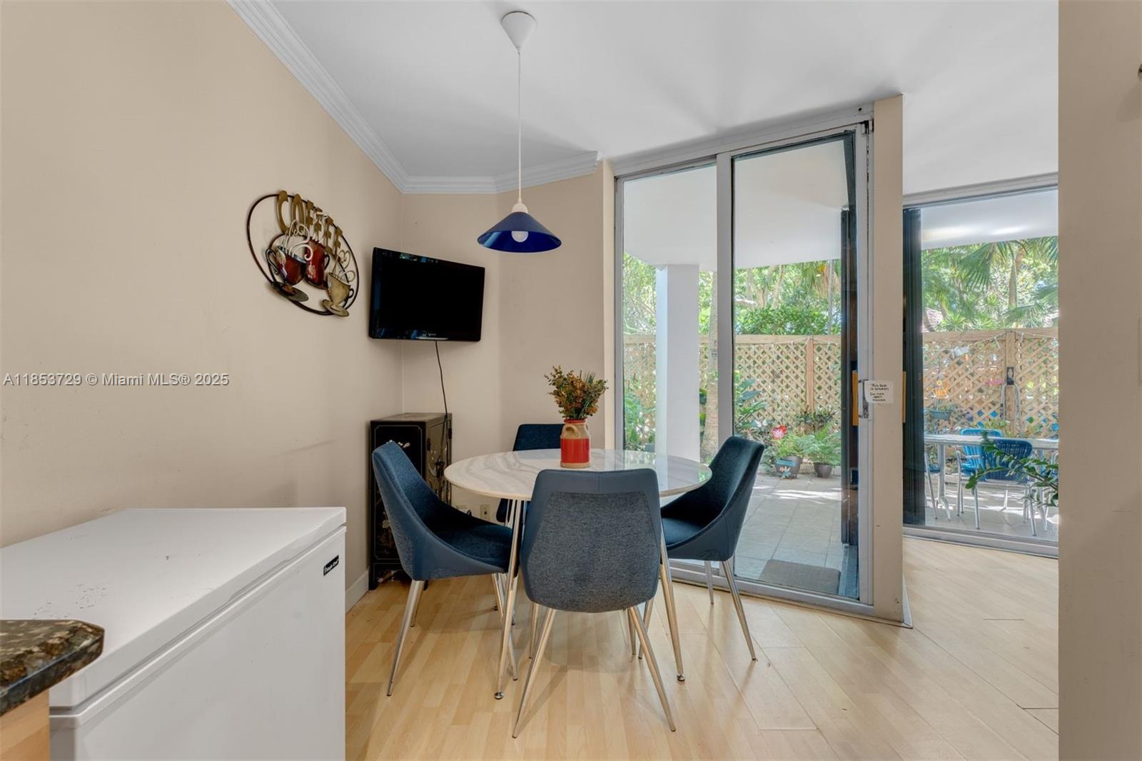 2000 Towerside Terrace, Unit 308 Miami, FL 33138 - Photo 5 of 16 a view of a dining room with furniture window and outside view
