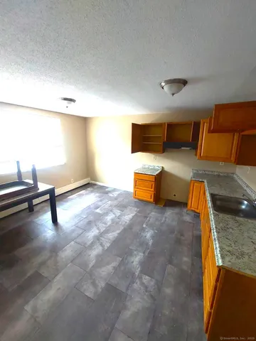 a view of a kitchen with a sink