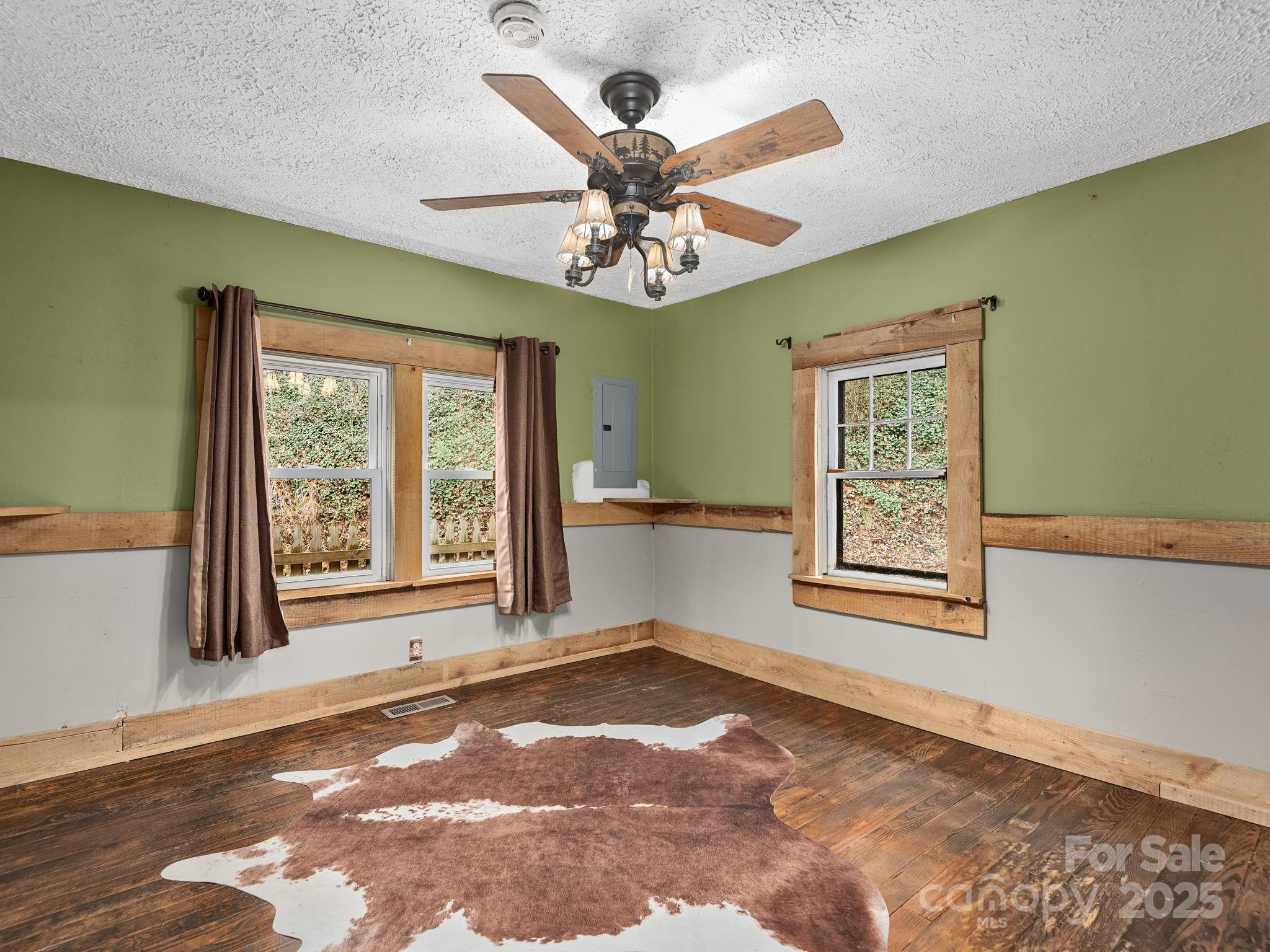 32 Saunooke Road Asheville, NC 28805 - Photo 11 of 17 a view of an empty room with a window and chandelier fan