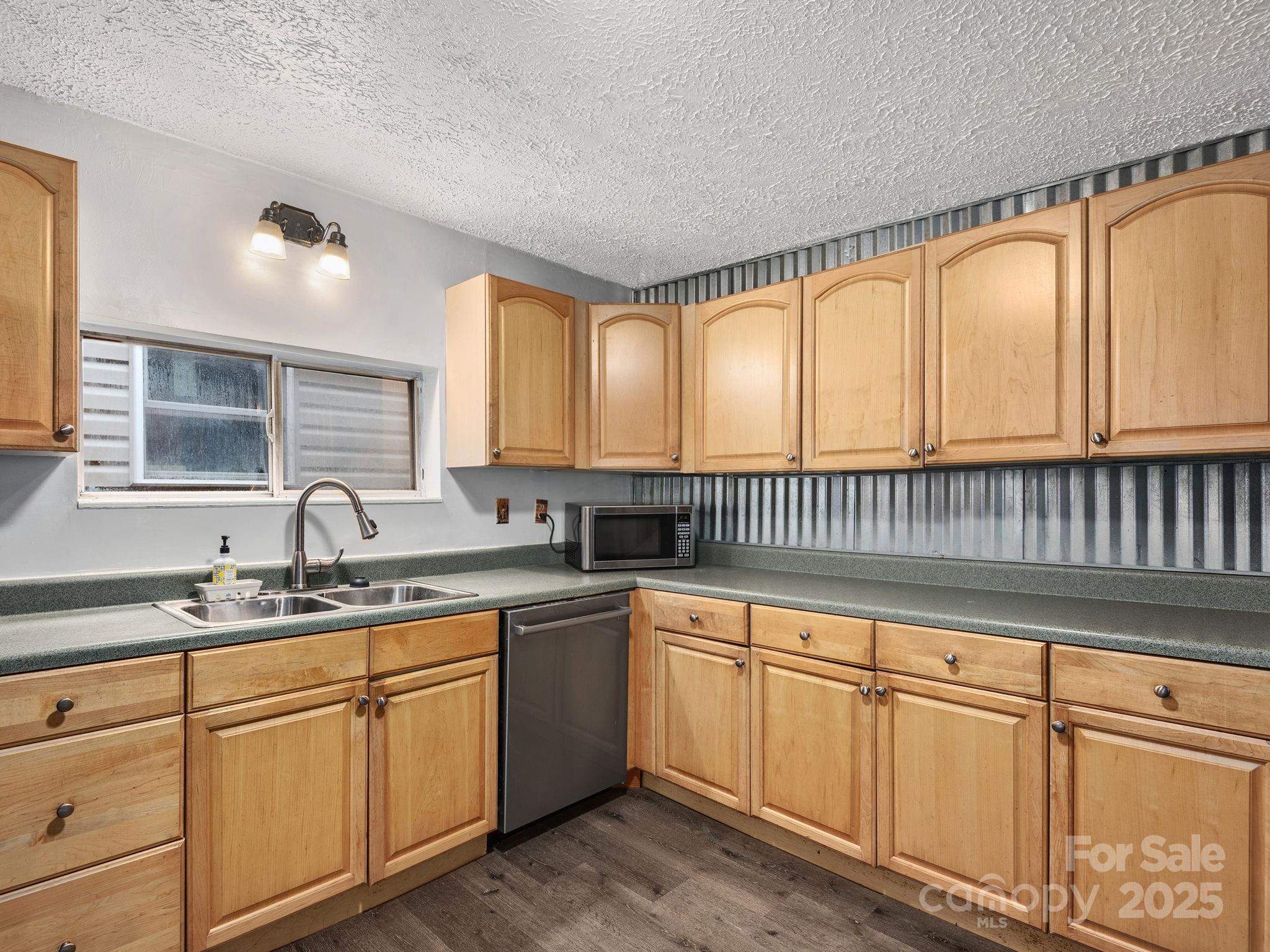 32 Saunooke Road Asheville, NC 28805 - Photo 7 of 17 a kitchen with a sink and cabinets