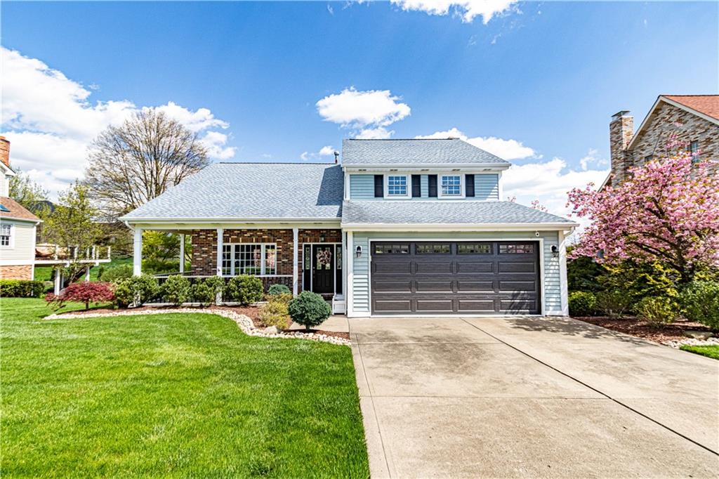 a front view of a house with a yard table and chairs