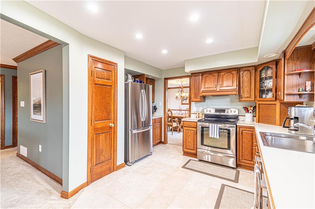 331 Cobblestone Circle McKees Rocks, PA 15136 - Photo 12 of 44 a kitchen with stainless steel appliances granite countertop a refrigerator stove and sink