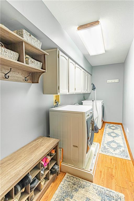 331 Cobblestone Circle McKees Rocks, PA 15136 - Photo 17 of 44 a utility room with a washer dryer and a fireplace