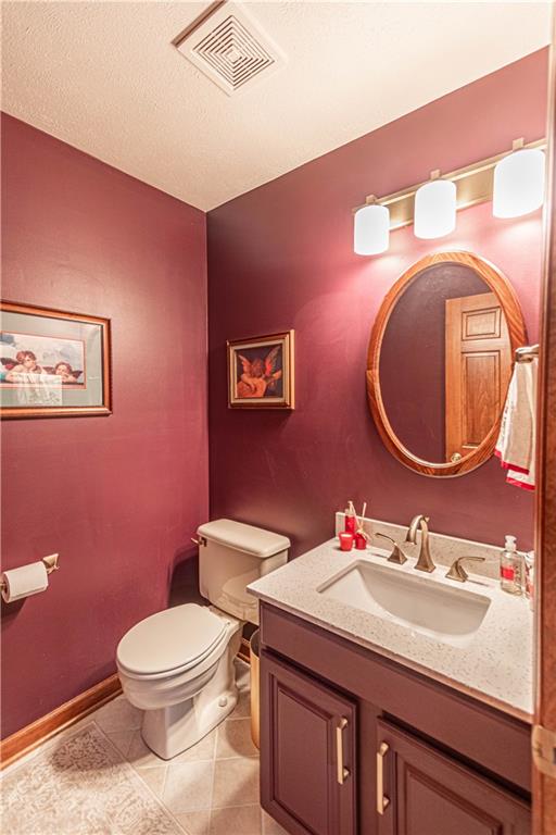 331 Cobblestone Circle McKees Rocks, PA 15136 - Photo 18 of 44 a bathroom with a granite countertop toilet sink and mirror