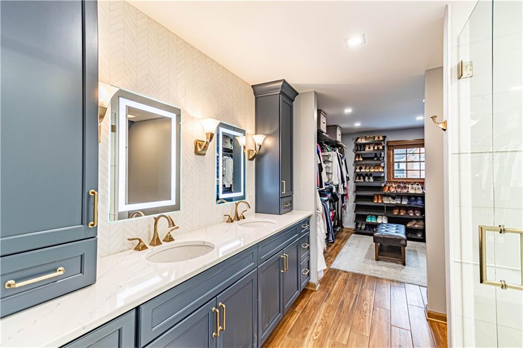 331 Cobblestone Circle McKees Rocks, PA 15136 - Photo 25 of 44 a spacious bathroom with a shower a sink and a large mirror