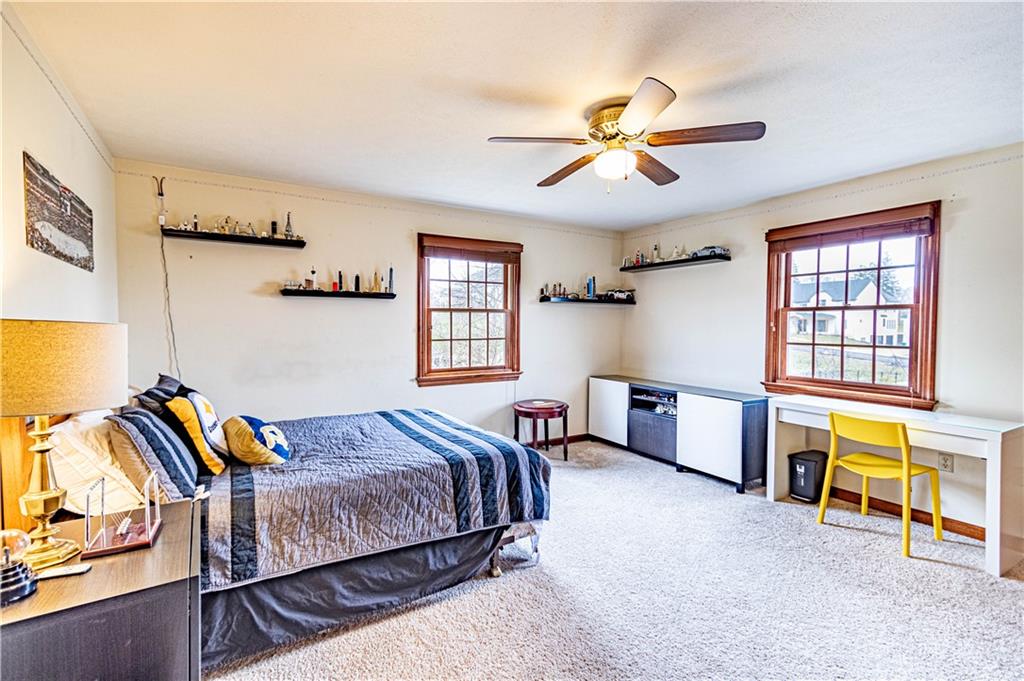 331 Cobblestone Circle McKees Rocks, PA 15136 - Photo 28 of 44 a bedroom with a bed and a chandelier