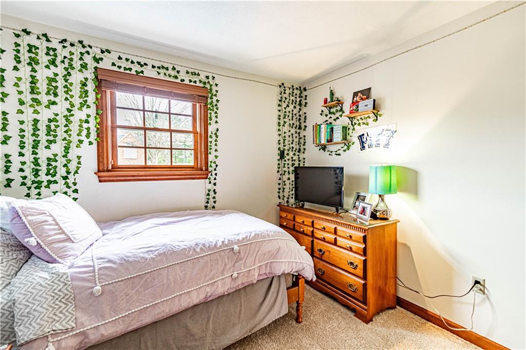 331 Cobblestone Circle McKees Rocks, PA 15136 - Photo 31 of 44 a bedroom with a bed and a dresser in it