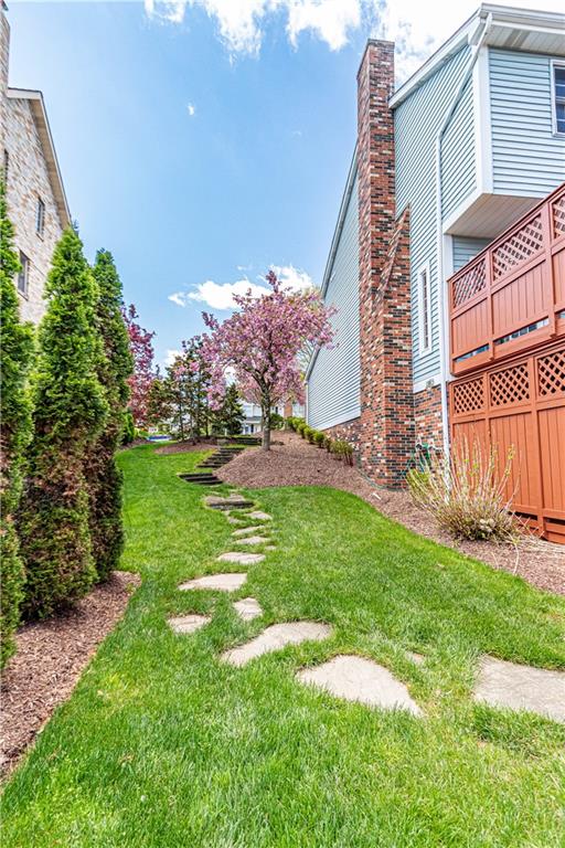 331 Cobblestone Circle McKees Rocks, PA 15136 - Photo 44 of 44 a backyard of a house with lots of green space