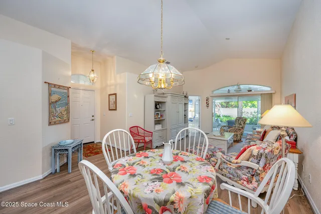 a kitchen with a table and chairs in it