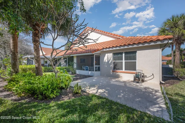 a living room with furniture and a lamp
