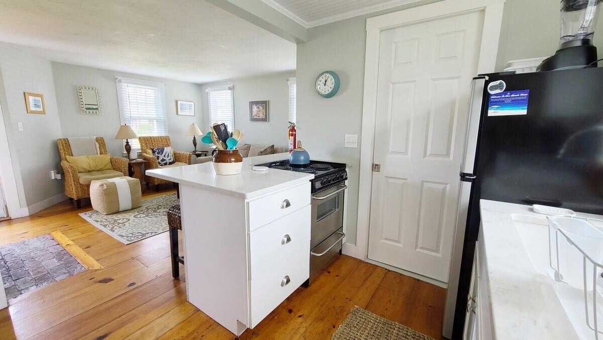 670 Shore Road, Unit 5 Truro, MA 02666 - Photo 13 of 22 a view of living room with furniture and wooden floor