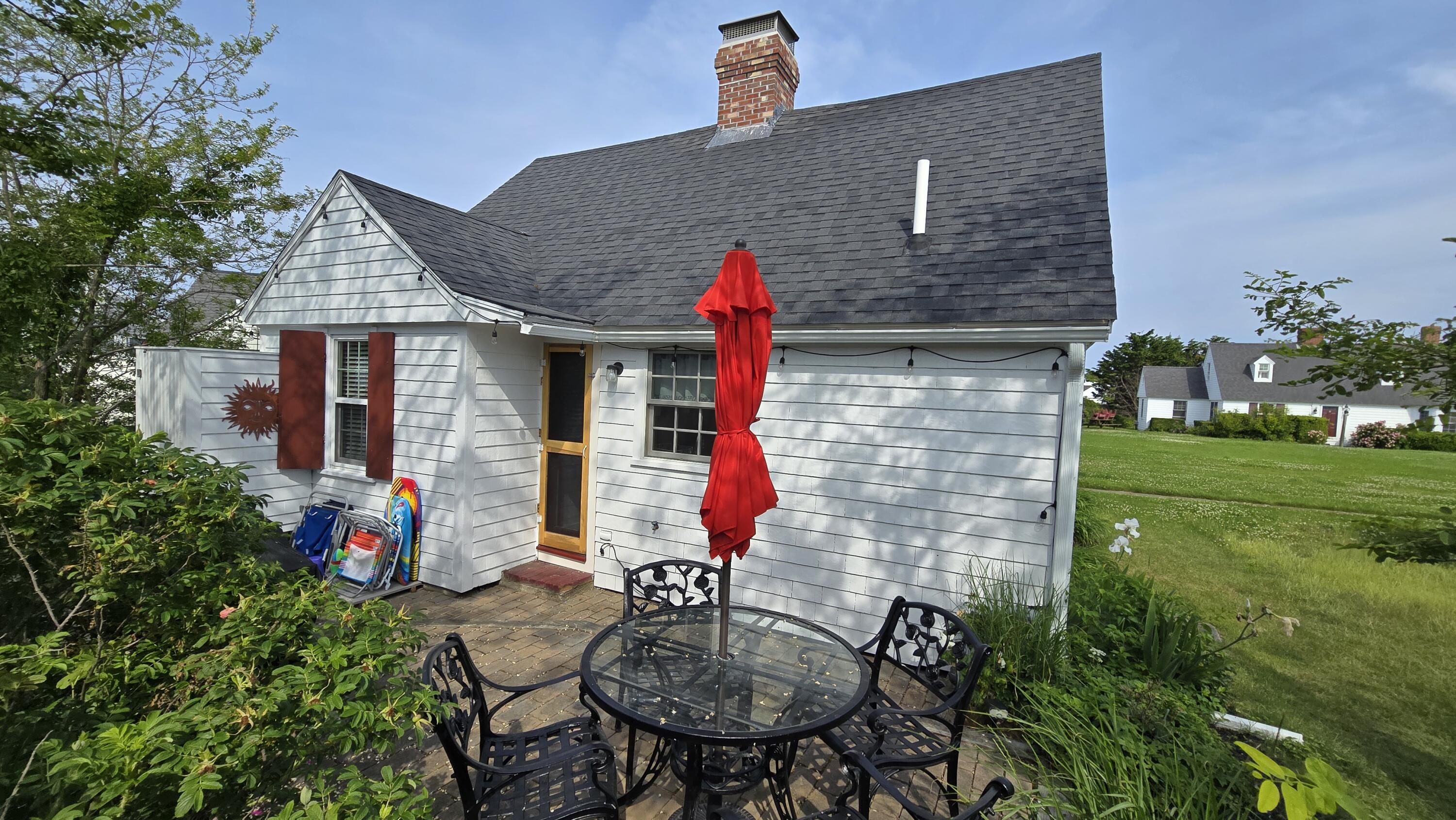 670 Shore Road, Unit 5 Truro, MA 02666 - Photo 3 of 22 a front view of a house with patio