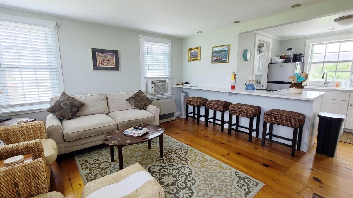 670 Shore Road, Unit 5 Truro, MA 02666 - Photo 10 of 22 a living room with furniture wooden floor and window