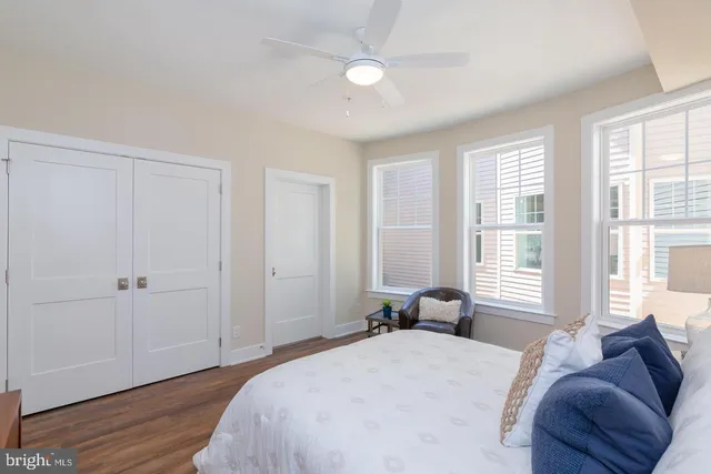 a bed room with a bed and a window