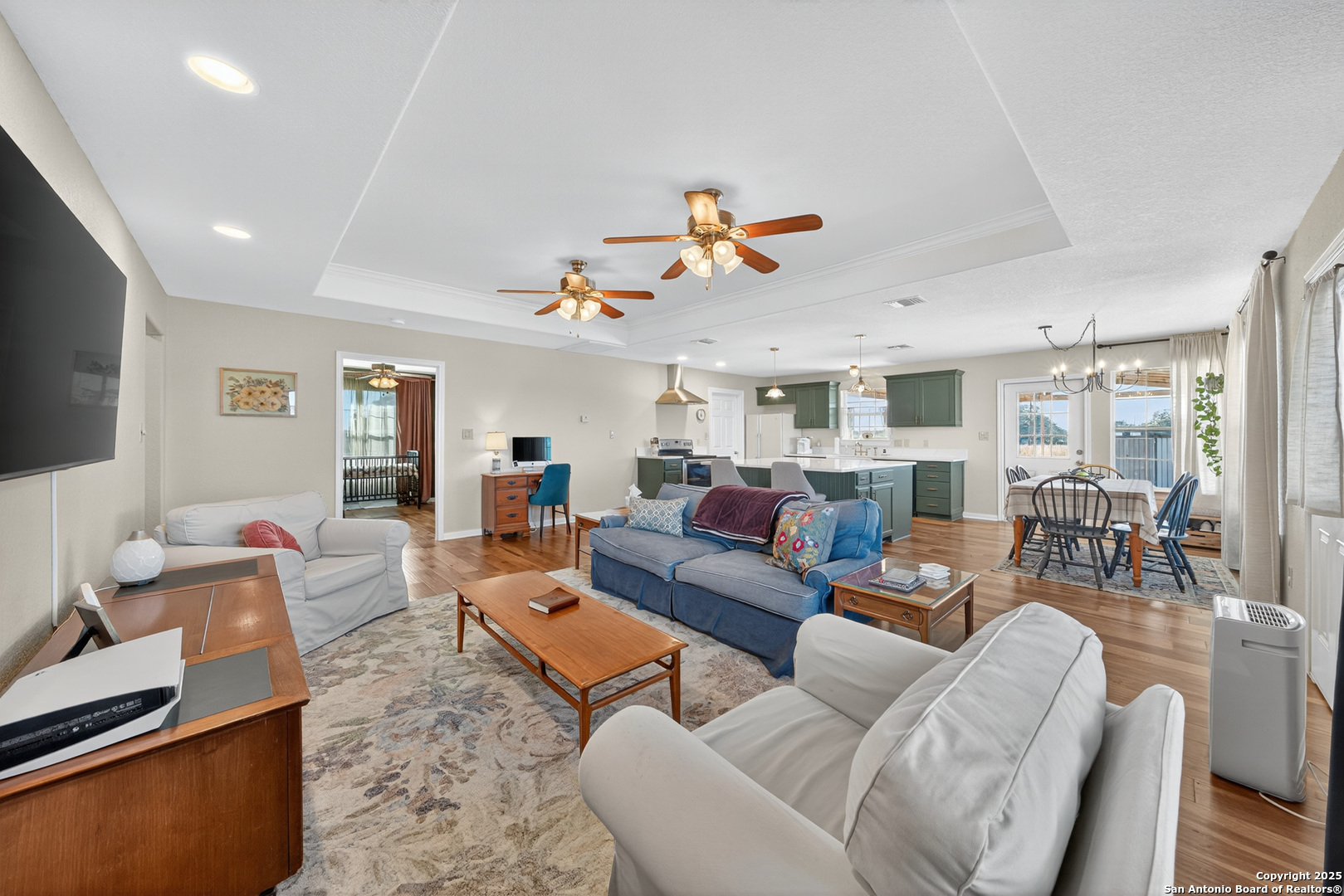 118 Stallion Trail Natalia, TX 78059 - Photo 11 of 35 a living room with furniture kitchen view and a large window