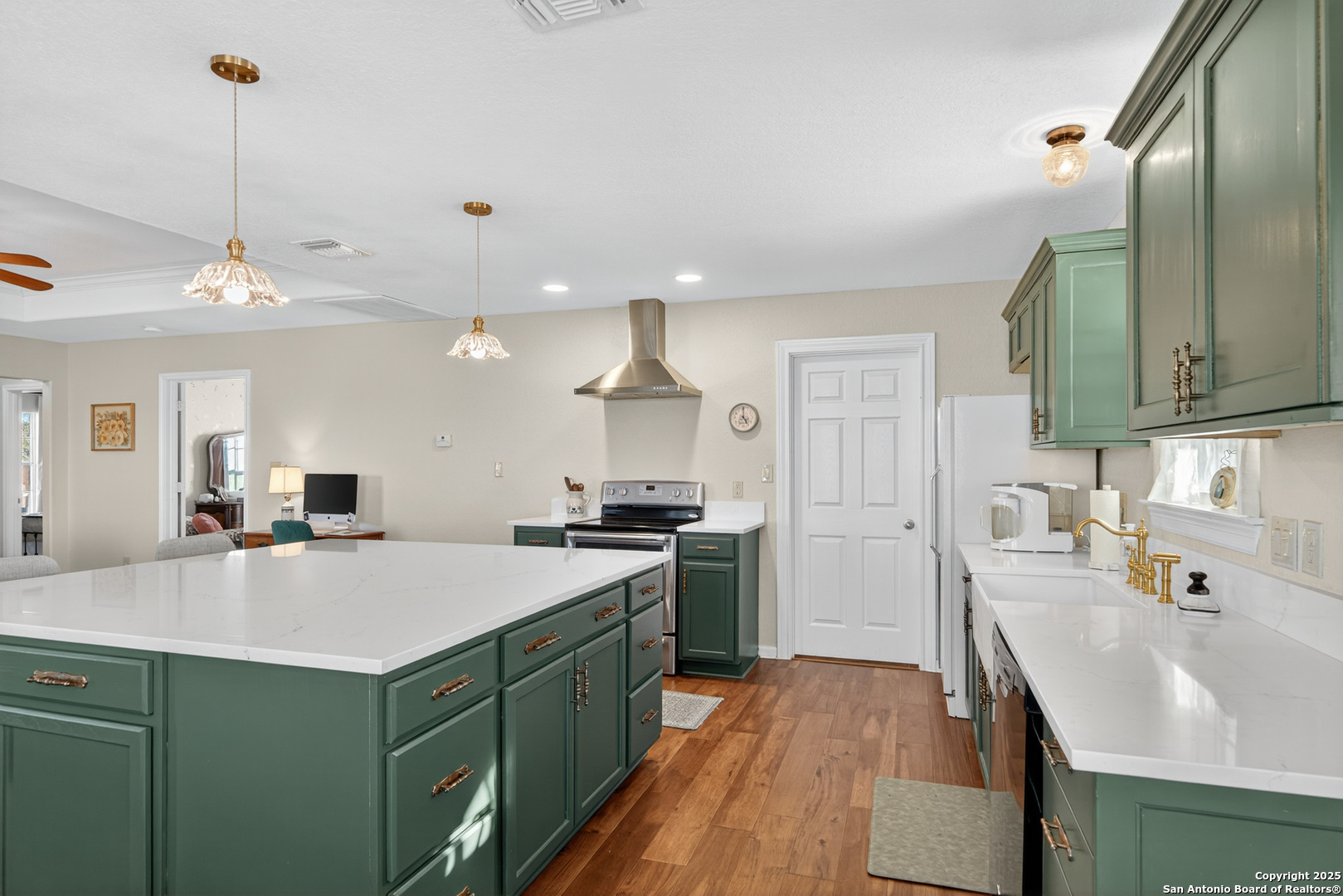 118 Stallion Trail Natalia, TX 78059 - Photo 13 of 35 a kitchen with a sink appliances and cabinets