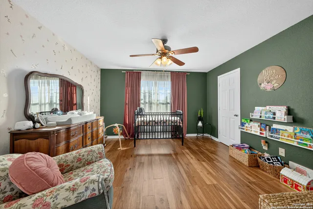 a living room with furniture stairs and a window
