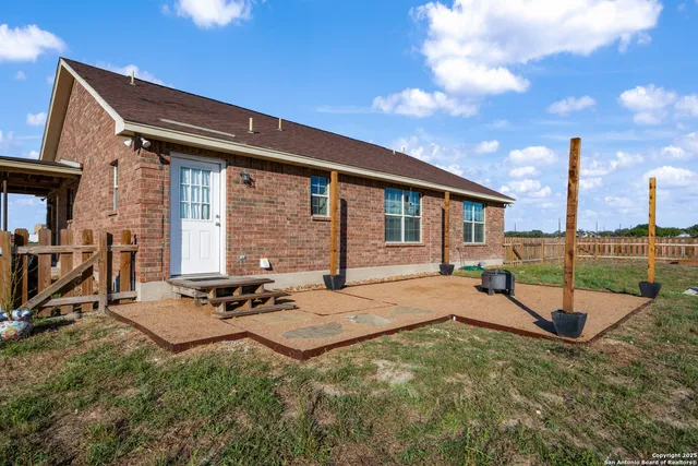 a view of a garden with a house