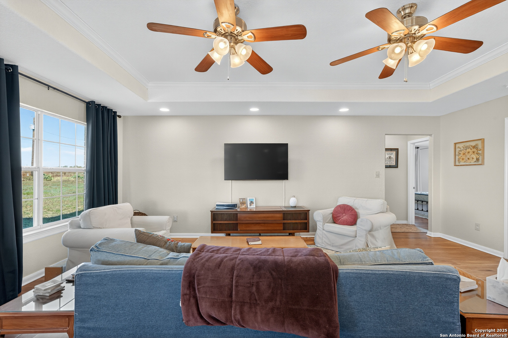 118 Stallion Trail Natalia, TX 78059 - Photo 7 of 35 a bedroom with a bed and a chandelier