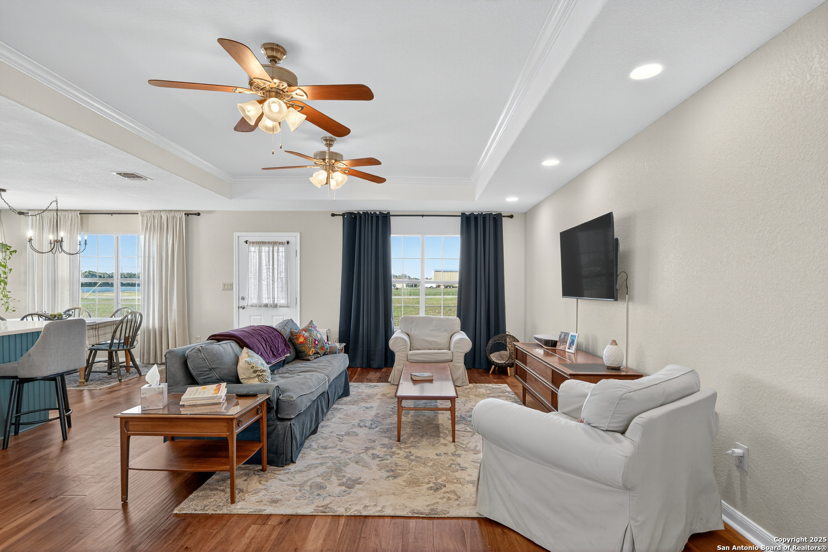 118 Stallion Trail Natalia, TX 78059 - Photo 9 of 35 a living room with furniture ceiling fan and a window