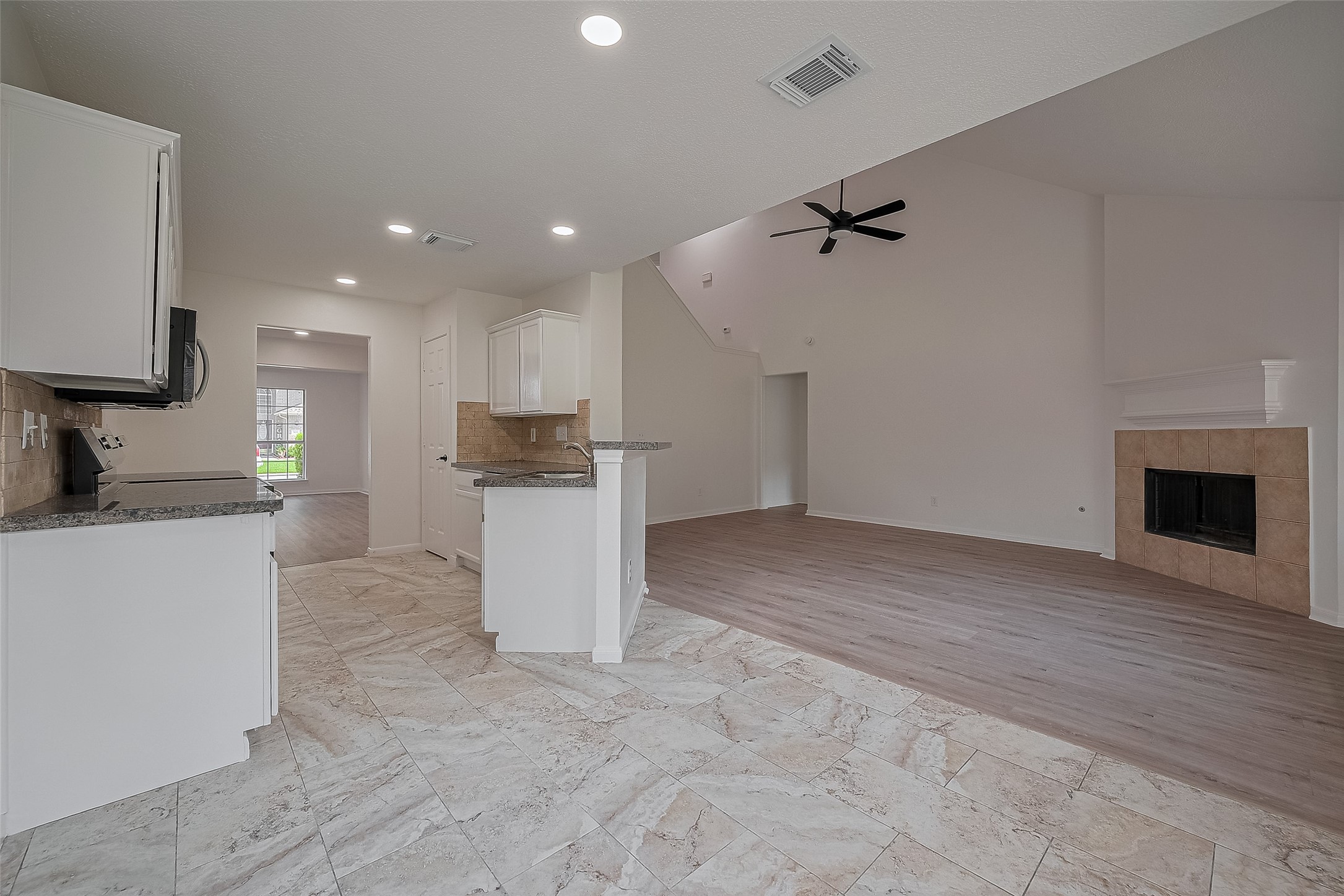 3223 Candlepine Drive Spring, TX 77388 - Photo 11 of 34 a view of a kitchen with a sink and a stove top oven