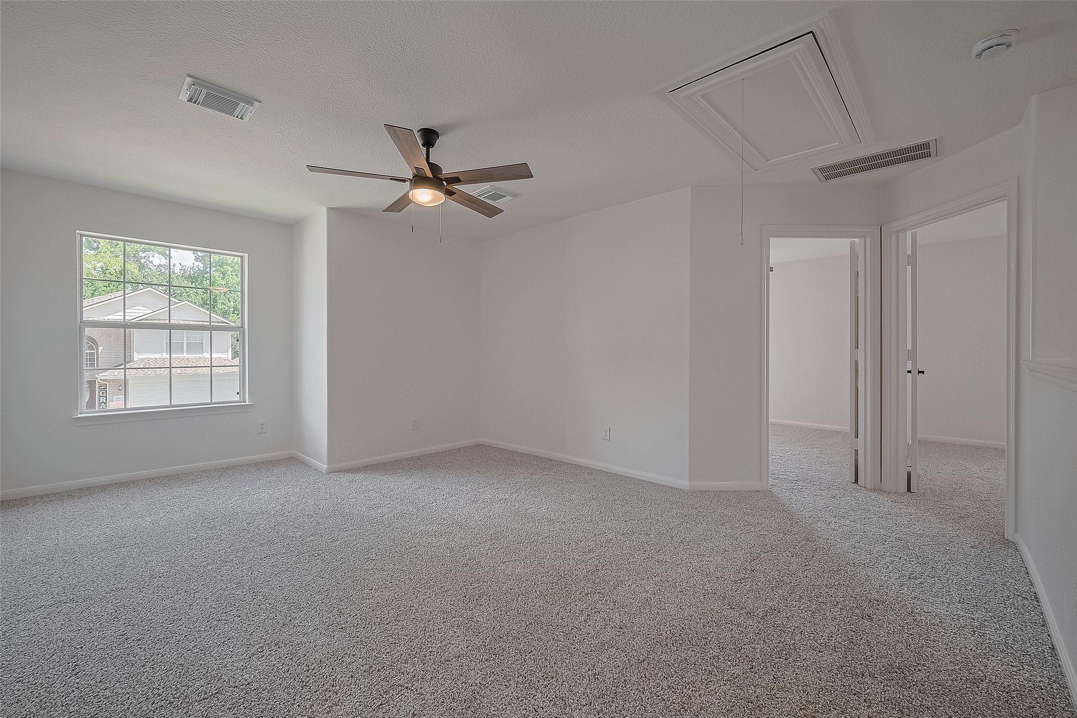 3223 Candlepine Drive Spring, TX 77388 - Photo 17 of 34 an empty room with windows and fan