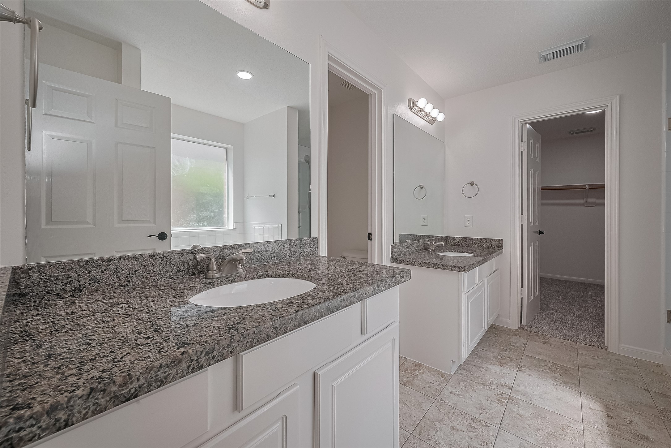 3223 Candlepine Drive Spring, TX 77388 - Photo 28 of 34 a bathroom with a granite countertop sink and a mirror