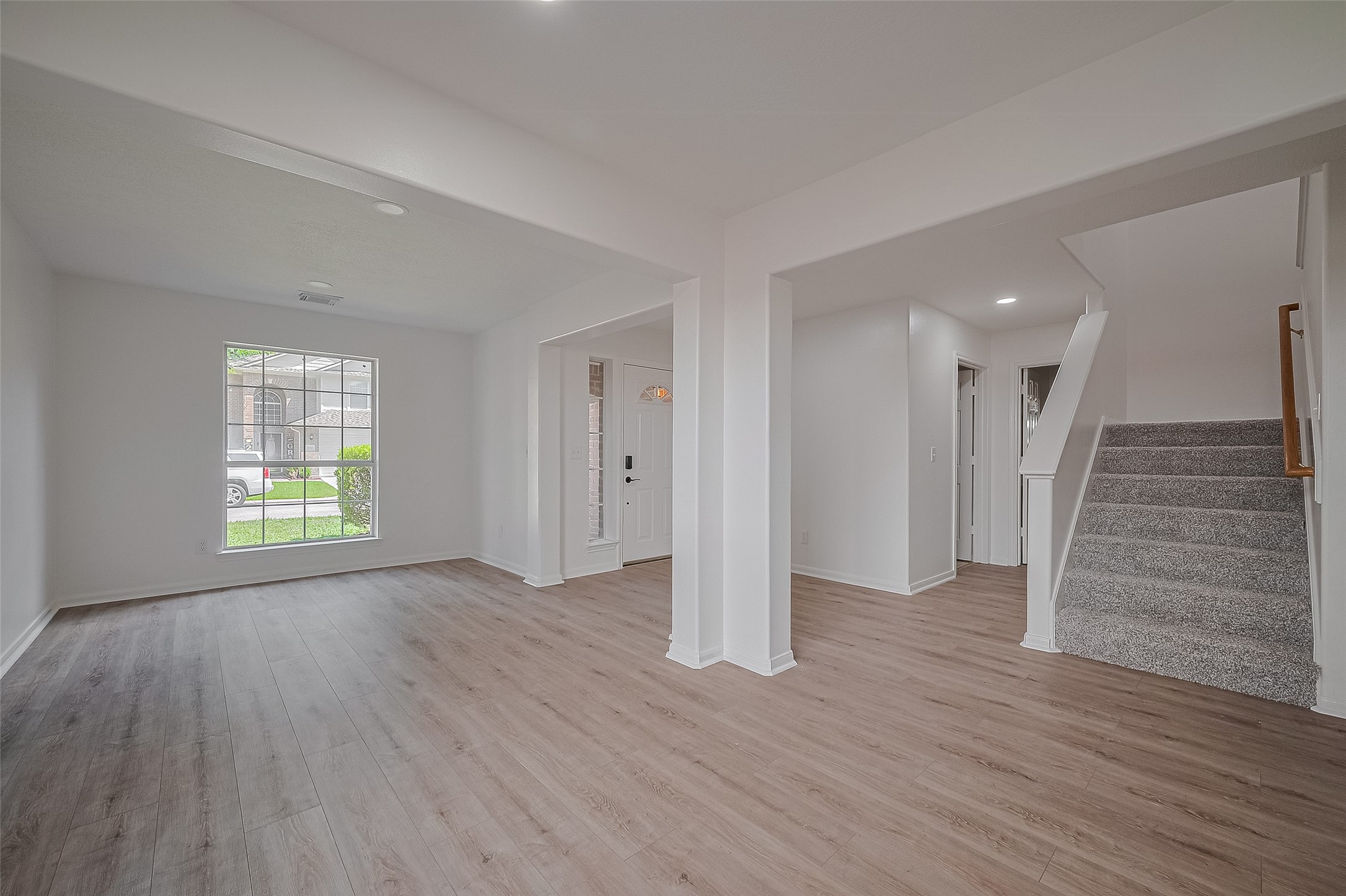 3223 Candlepine Drive Spring, TX 77388 - Photo 5 of 34 an empty room with wooden floor and windows