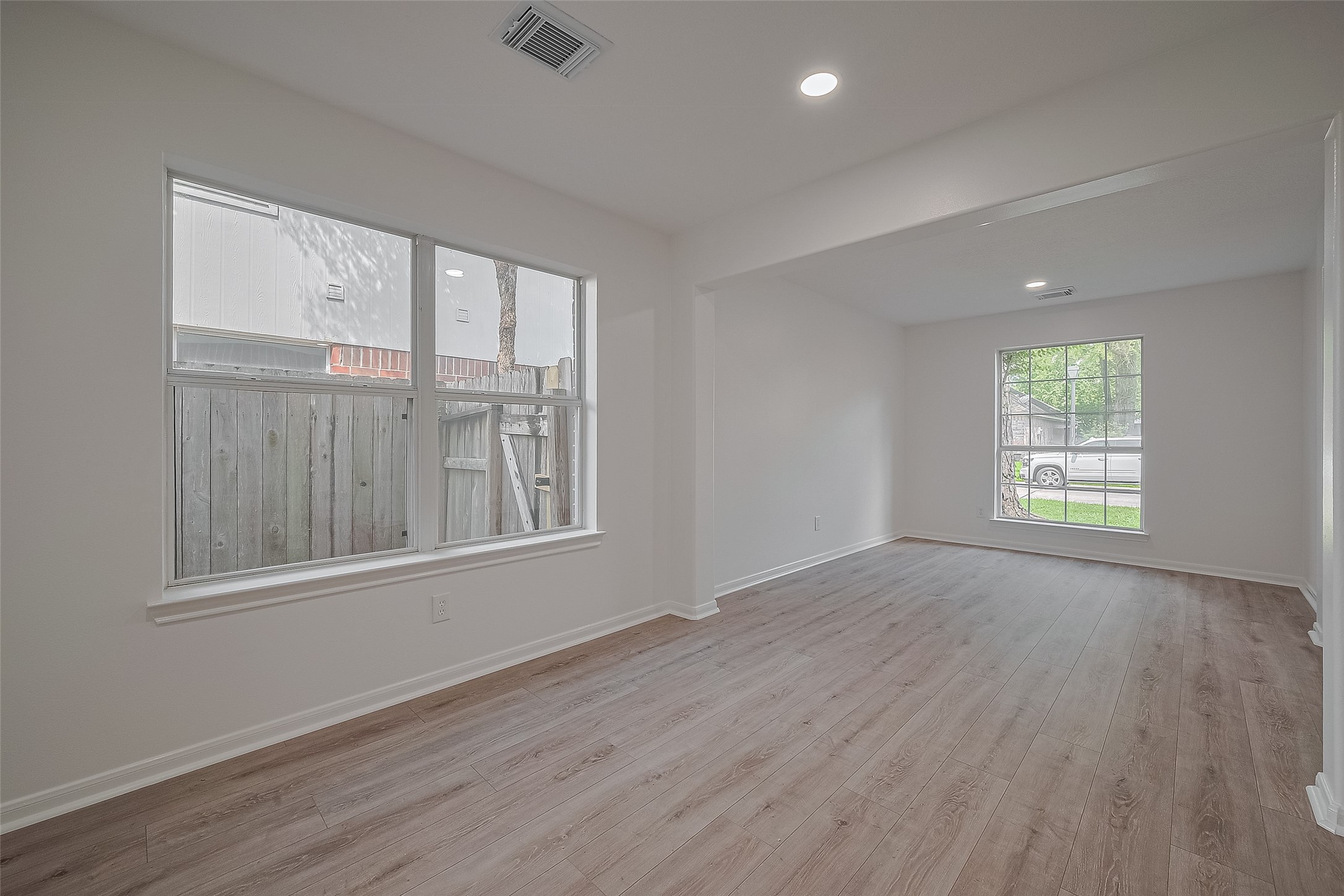 3223 Candlepine Drive Spring, TX 77388 - Photo 6 of 34 a view of an empty room with wooden floor and a window