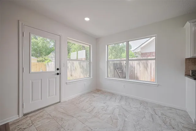 an empty room with windows