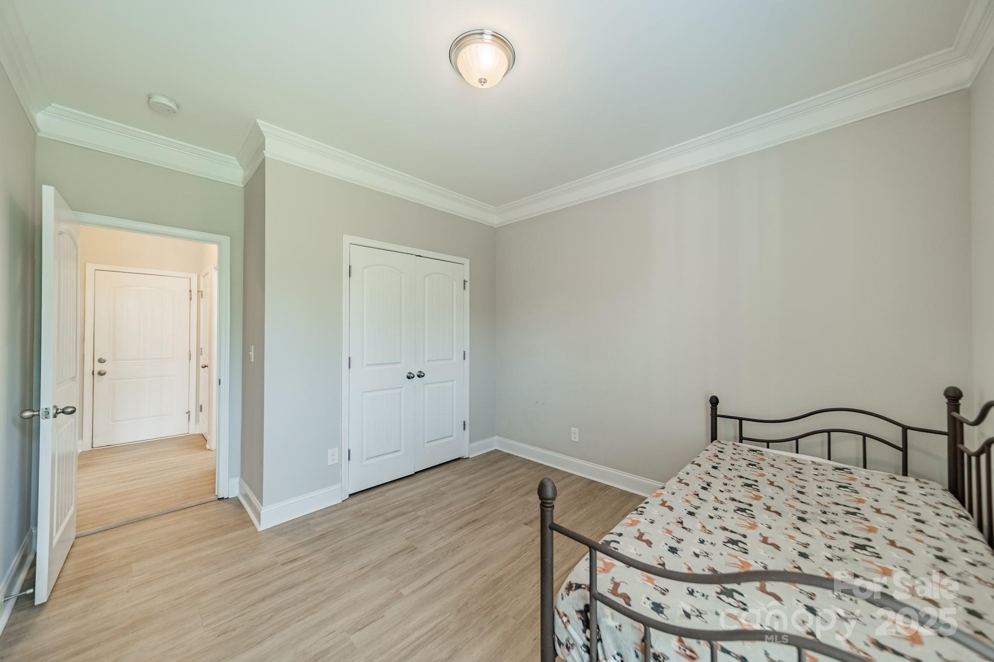 9229 Inverness Bay Road Charlotte, NC 28278 - Photo 12 of 41 a bedroom with a bed and a table