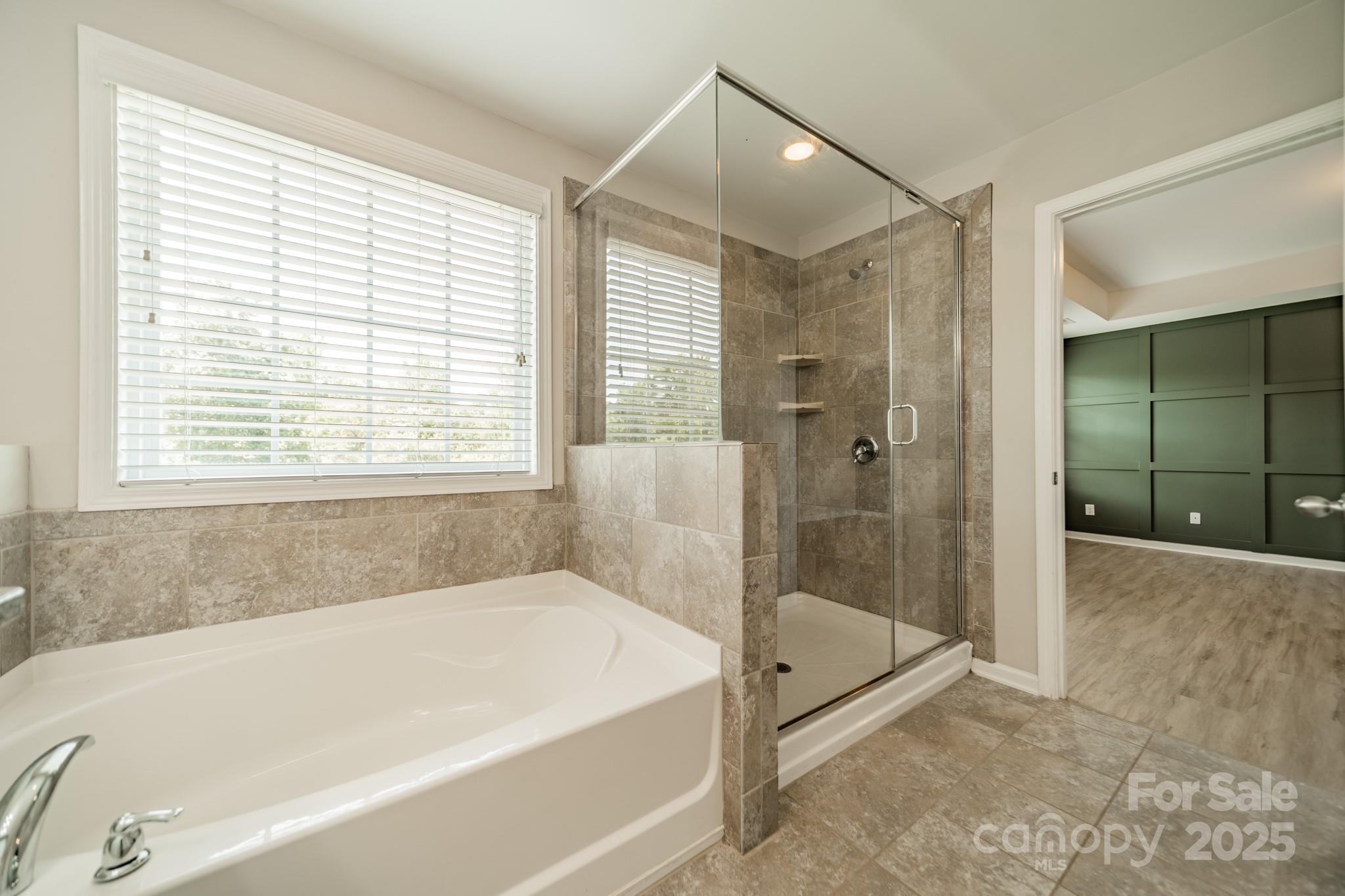 9229 Inverness Bay Road Charlotte, NC 28278 - Photo 17 of 41 a spacious bathroom with a granite countertop tub shower and a sink