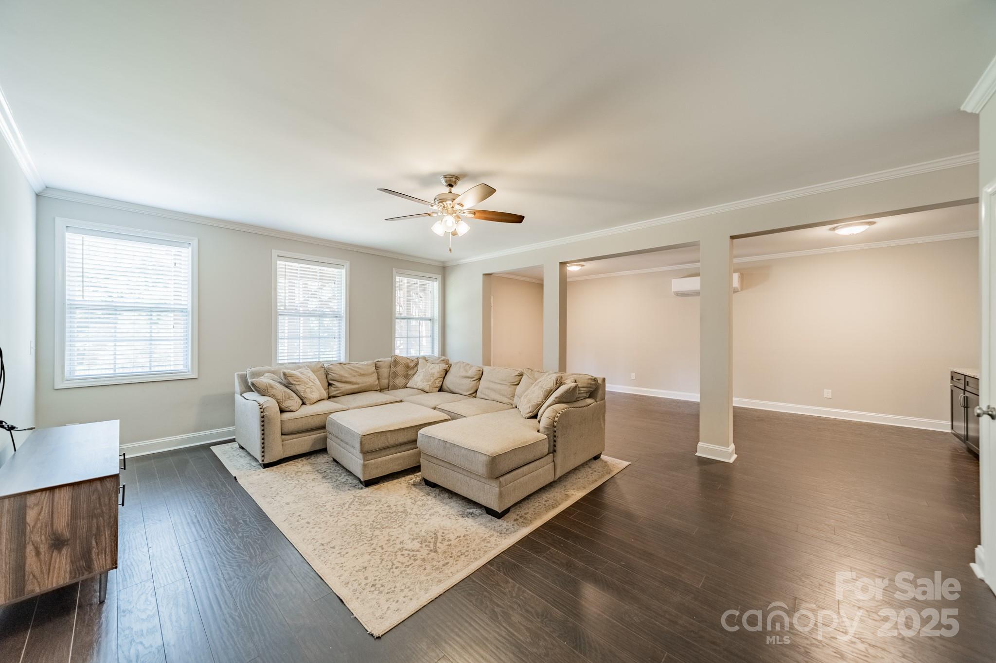 9229 Inverness Bay Road Charlotte, NC 28278 - Photo 24 of 41 a living room with furniture and wooden floor