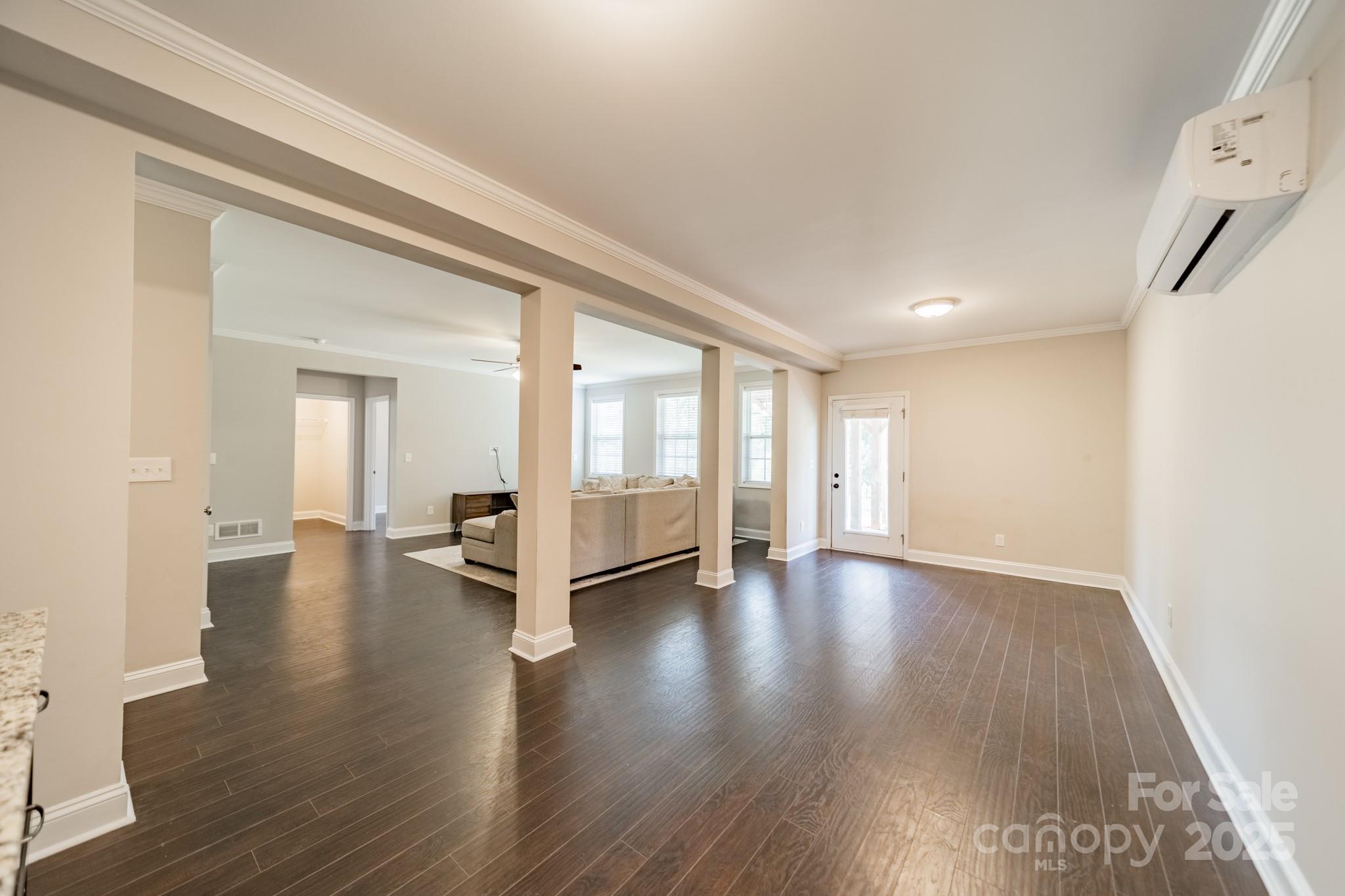 9229 Inverness Bay Road Charlotte, NC 28278 - Photo 28 of 41 a view of an empty room with wooden floor and a window