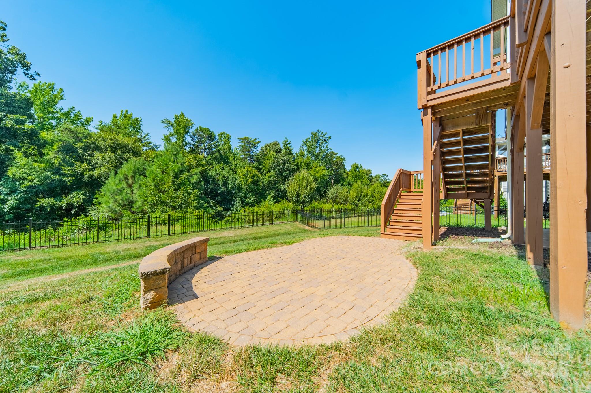 9229 Inverness Bay Road Charlotte, NC 28278 - Photo 34 of 41 a view of a backyard with a garden