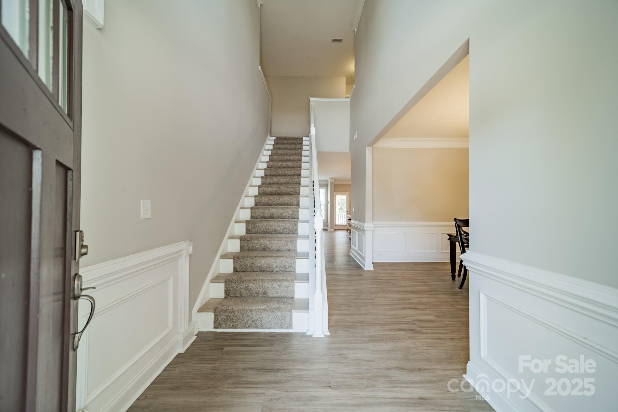 9229 Inverness Bay Road Charlotte, NC 28278 - Photo 5 of 41 a view of entryway and hall with wooden floor