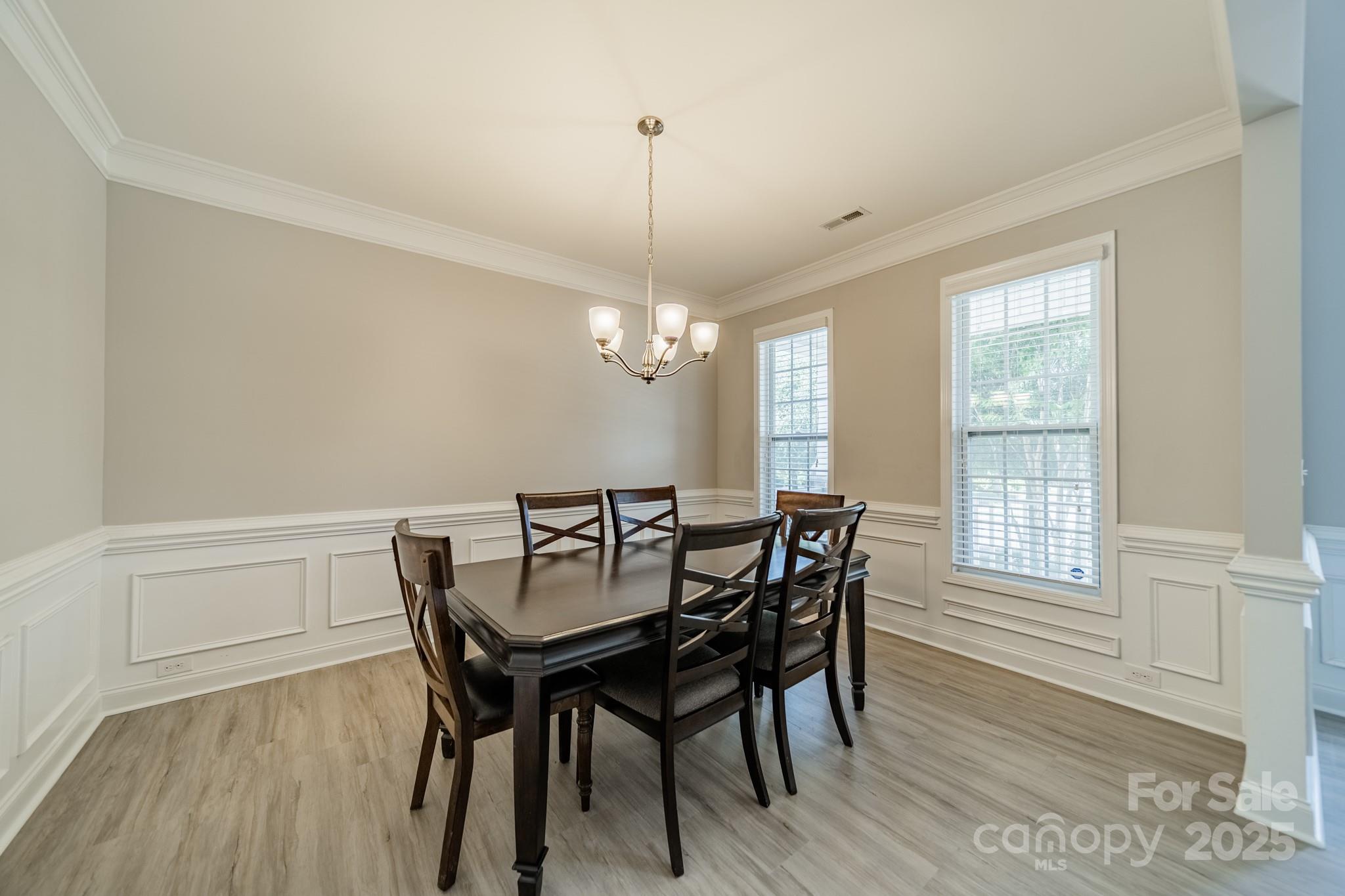 9229 Inverness Bay Road Charlotte, NC 28278 - Photo 6 of 41 a view of a dining room with furniture window and wooden floor