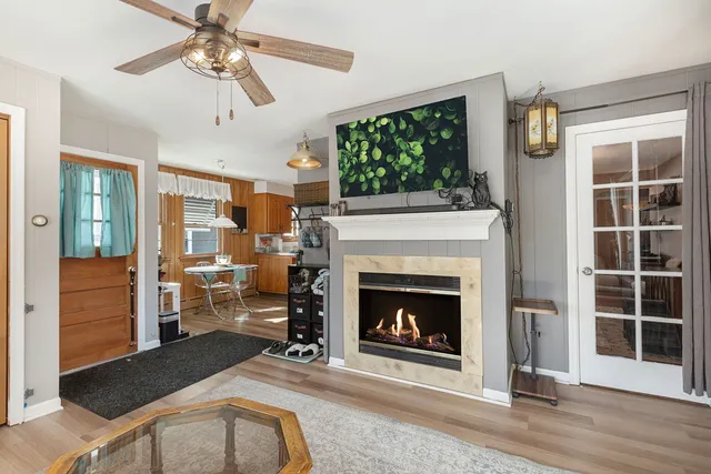 a living room with furniture and a fireplace