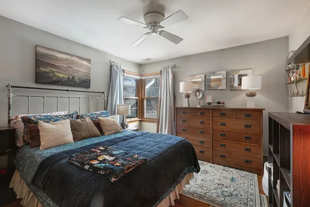 a bedroom with a bed and cabinet