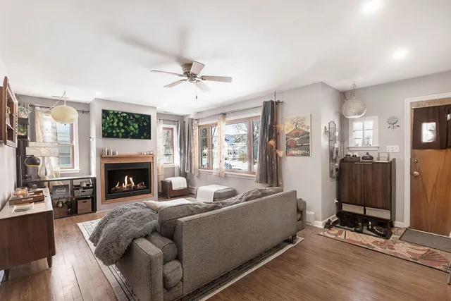 a living room with furniture fireplace and flat screen tv