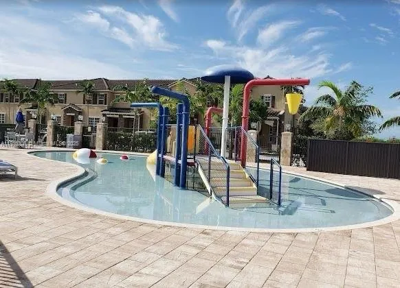an outdoor space with lots of potted plants