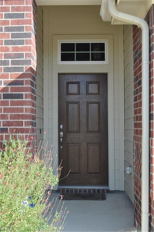 3645 Rams Horn Way Round Rock, TX 78665 - Photo 2 of 16 View of exterior entry with brick siding